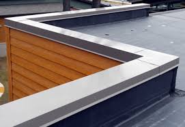 parapet cap on a roof showing brown siding.